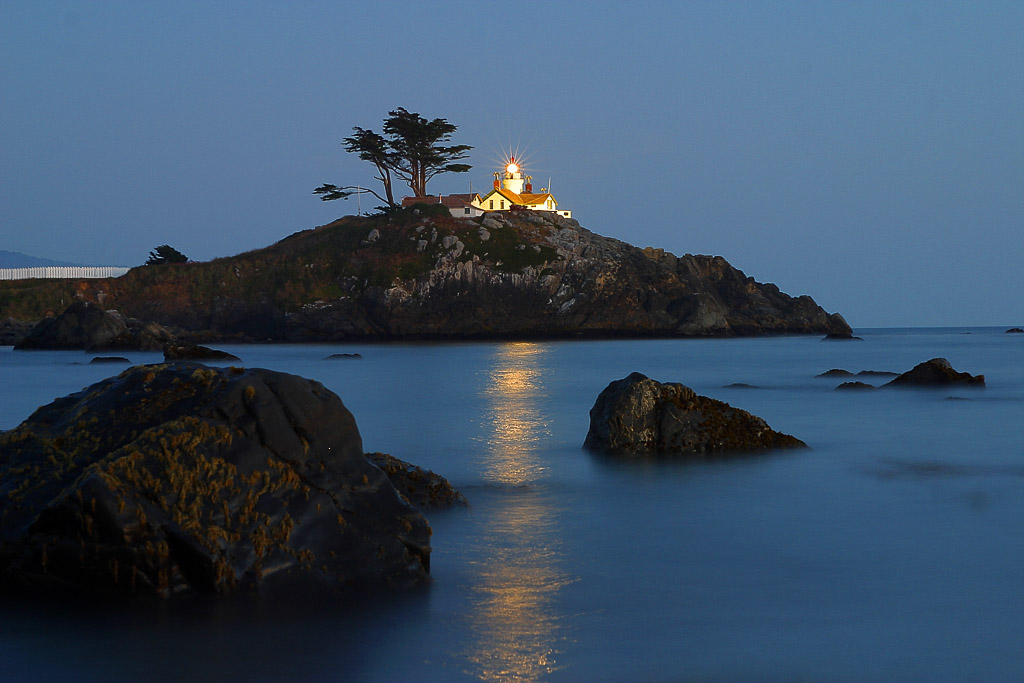 Some lonely lighthouses along the nothern California coastline are catering for some very quiet shots during the evening hours. This one was taken standing knee deep in the Pacific ocean on the beach of Crescent City, California